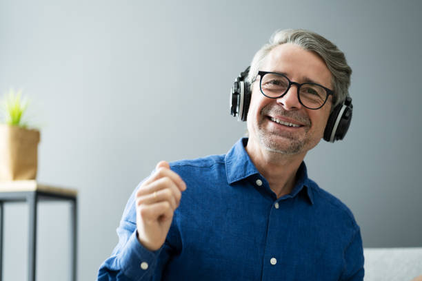 istock Smiling Older Senior Listening Music 1287081170