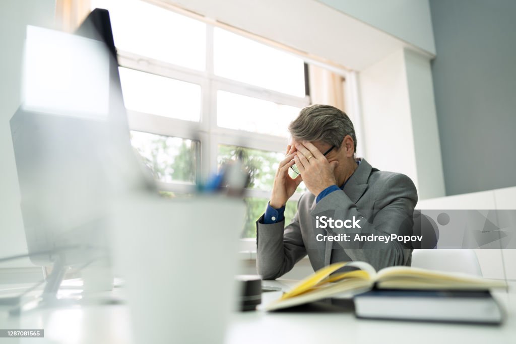 Frustrated Unhappy Workaholic Businessperson Frustrated Unhappy Workaholic Businessperson. Disappointed Employee Problem Frustration Stock Photo