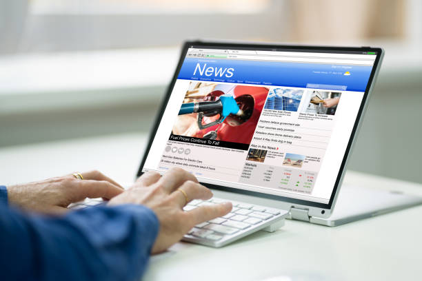istock Digital Newspaper On Convertible Laptop Screen 1287081657
