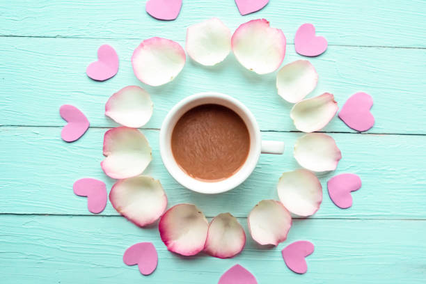 istock Rose petals round frame on wooden background, copy space for the text 1287081920