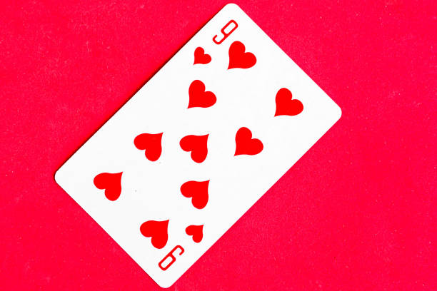 istock Nine of Hearts playing card, red background. 1287081932