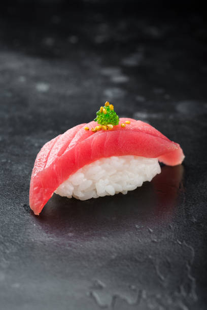 istock Sushi nigiri with tuna on black background 1287082255