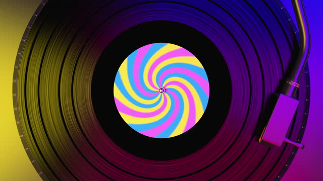 Black vinyl record spinning and play music on dj turntable with colorful label