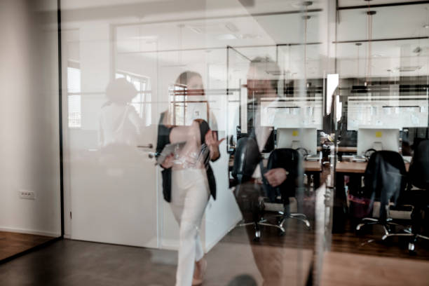 istock Business colleagues walking through the office 1287084855