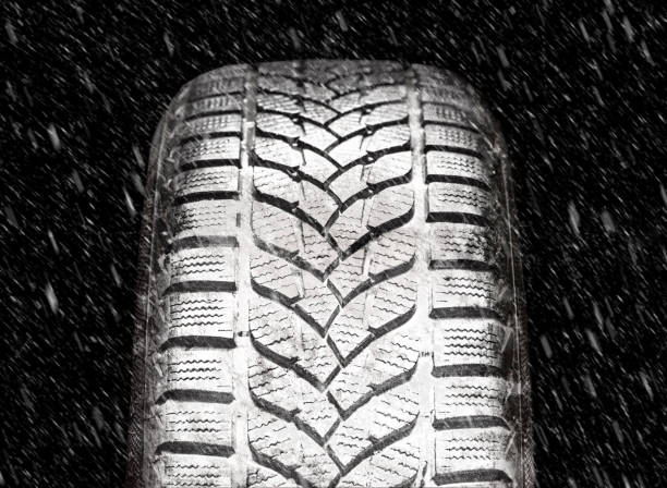 istock Winter tires in snowfall. High quality and high resolution studio shooting. 1287085105