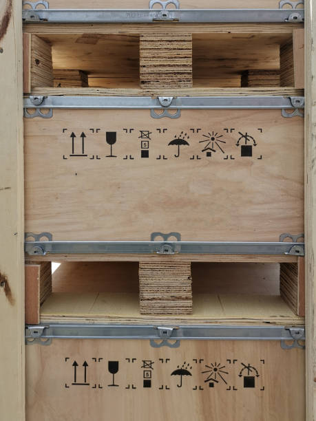 istock Wooden container box with pallet and warning delivery symbol painted on it for shipping 1287085355