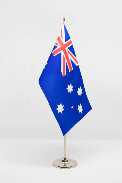 istock State desktop flag of Australia on metal flagpole isolated on white background. 1287086320