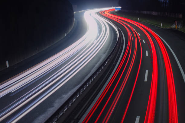 istock Red and white car trail lights on highway. 1287086725
