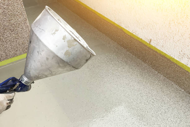 istock A man's hand paints the steps with a spray gun 1287086863
