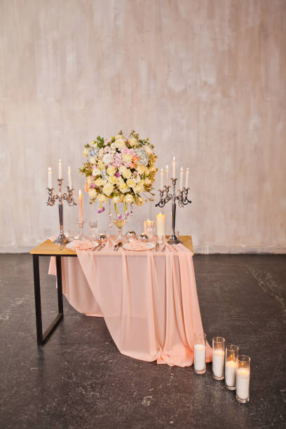 istock Decorating a wedding table with candles and expensive dishes 1287088156