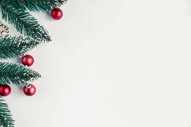 istock christmas tree branches with baubles on white background, copy space for the text 1287089242