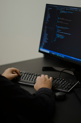 Programmer Working On Computer From Home Stock Photo - Download Image ...