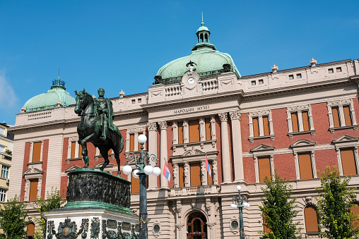 Belgrade / Serbia - August 8, 2020: The statue of Prince Mihailo Obrenovic and National Museum of Serbia in the Republic Square in Belgrade, Serbia