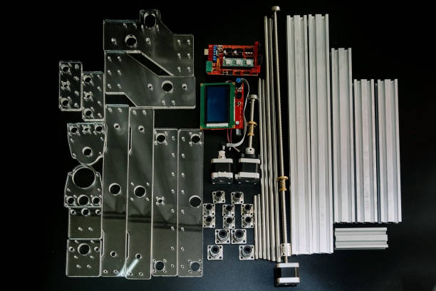 istock a set of parts for a laser machine on a black background, silver backlight, flat lay open-source hardware and software board for controlling the machine and v slot aluminum profile lies 1287091045