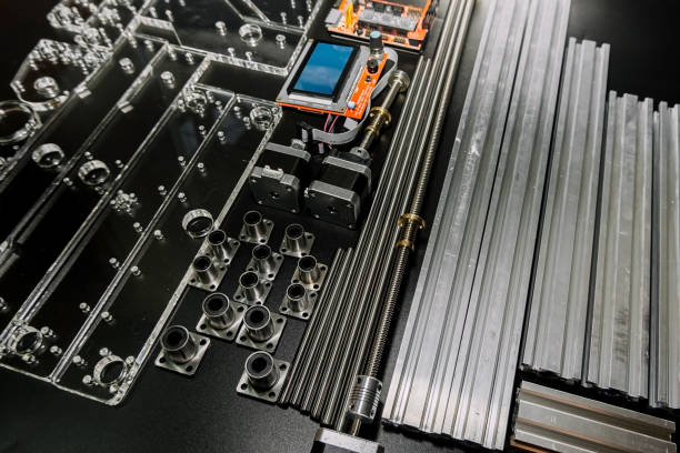 istock a set of parts for a laser machine on a black background, silver backlight, flat lay open-source hardware and software board for controlling the machine and v slot aluminum profile lies 1287091806