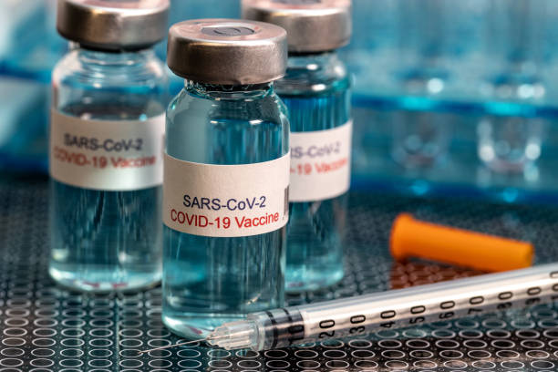 istock Covid-10 Vaccine and Syringe 1287095236