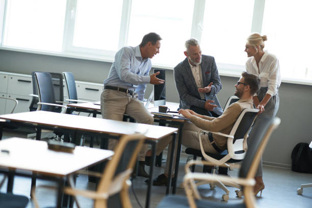 istock Brainstorming meeting. Business people discussing something while working together in the modern office 1287096448