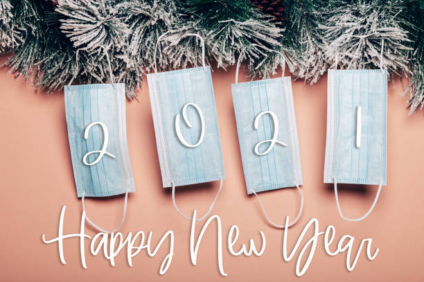 istock New reality, xmas tree decorated with face masks 1287097882