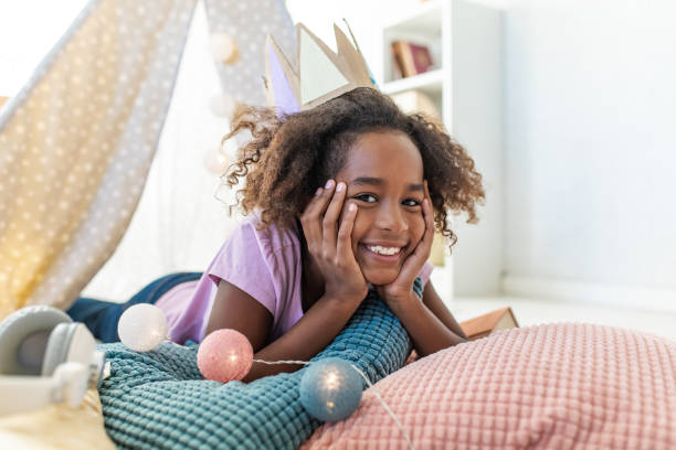 istock Young girl playing at home 1287099464