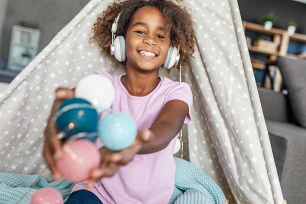 istock Young girl playing at home 1287100016