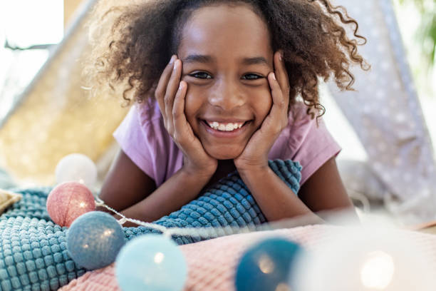 istock Young girl playing at home 1287100199