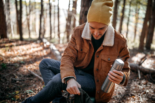 istock Young man camping alone on beautiful autumn day 1287100489