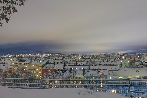 After dusk view of Oslo rooftops on a snowy day from Stensparken