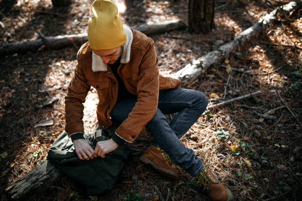 istock Young man camping alone on beautiful autumn day 1287100640
