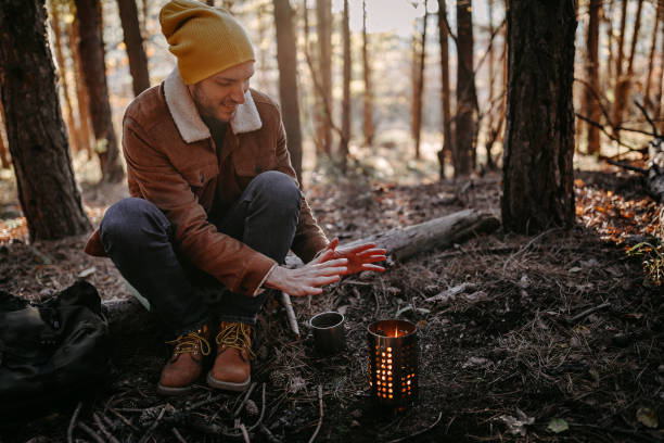 istock Young man enjoying beautiful autumn day in forest 1287100652