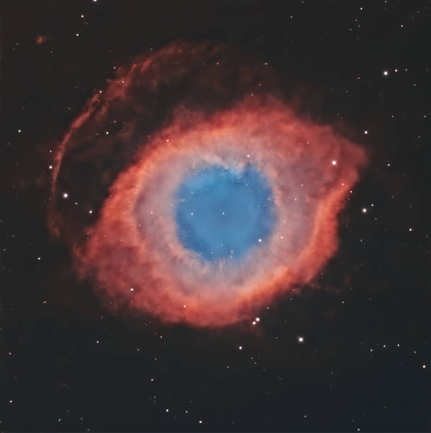 Helix Nebula - Ngc 7293 The Helix Nebula (also known as NGC 7293) is one of the closest planetary nebulae to Earth. In fact, it is located 650 light years from Earth in the constellation of Aquarius. It was discovered by Karl Ludwig Harding before 1824. eye nebula stock pictures, royalty-free photos & images