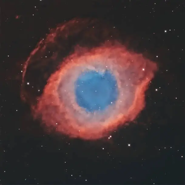 The Helix Nebula (also known as NGC 7293) is one of the closest planetary nebulae to Earth. In fact, it is located 650 light years from Earth in the constellation of Aquarius. It was discovered by Karl Ludwig Harding before 1824.