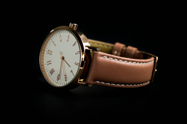 istock Woman watch isolated on black 1287102751
