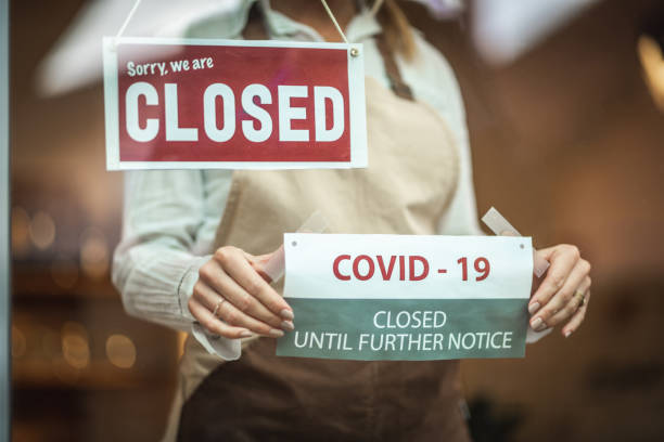 istock Closed sign and covid19 notice 1287104512