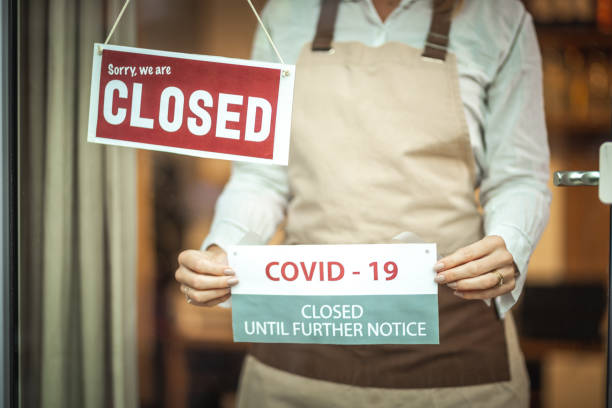 istock Closed sign and covid19 notice 1287105183