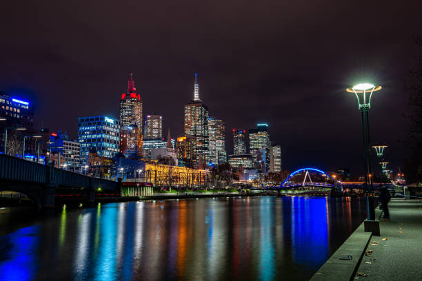 Yarra River by Night - Melbourne Melbourne, Australia - May 24, 2017: The city lights of the Melbourne CBD reflecting in the Yarra River as it runs through the heart of the city at night. yarra river stock pictures, royalty-free photos & images