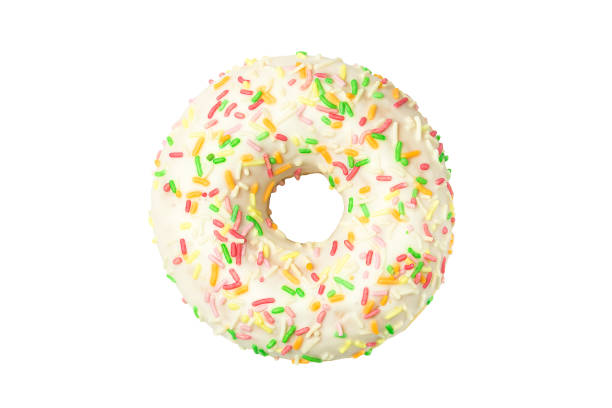 istock Donut in white glaze with colored sprinkles 1287106991