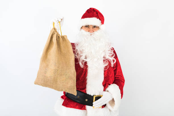 istock Santa Claus holding sack white background. Christmas concept 1287107713