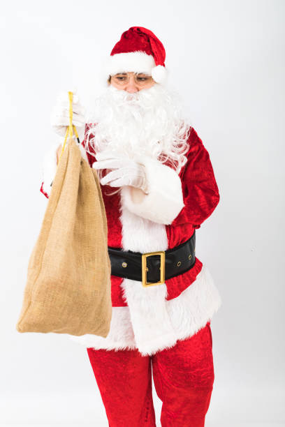istock Santa Claus holding sack white background. Christmas concept 1287107847