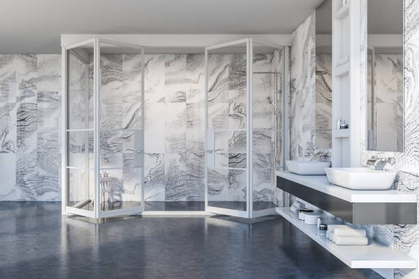 istock Modern white marble bathroom with sink and shower 1287109240