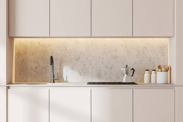 istock Minimalistic white kitchen with cabinets, close up 1287109269