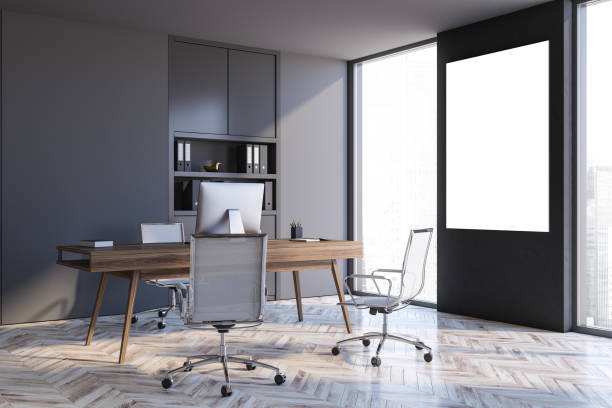 istock Table in gray CEO office corner with poster 1287109824