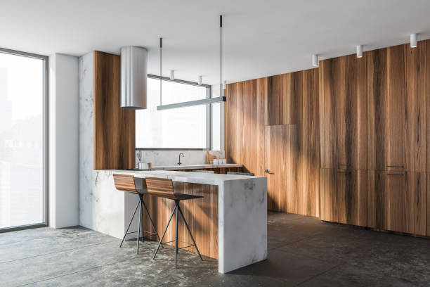 istock Modern white and wooden kitchen corner with bar 1287109944