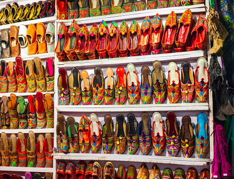 Traditional indian shoes at the Arpora night market in Goa state of India