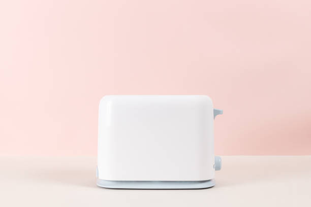 istock White toaster for toasting bread against pink background. 1287111008