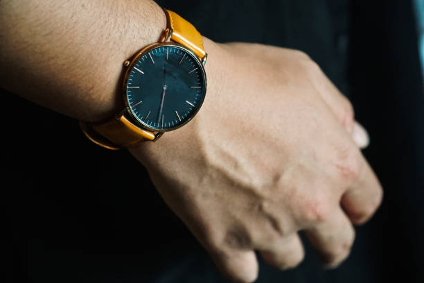 istock Watches with leather strap is worn on men's wrists 1287111335