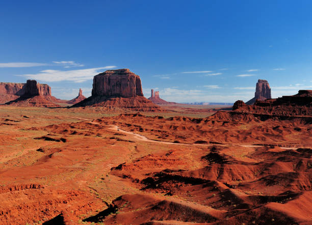 View From John Ford's Point To The Merrick Butte In The Monument Valley Arizona In The Morning On A Sunny Summer Day With A Clear Blue Sky View From John Ford's Point To The Merrick Butte In The Monument Valley Arizona In The Morning On A Sunny Summer Day With A Clear Blue Sky merrick butte stock pictures, royalty-free photos & images