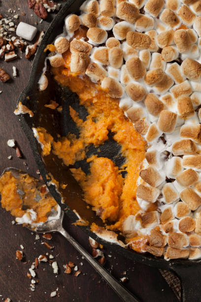 istock Sweet Potato Casserole with Pecans and Marshmallows 1287112439