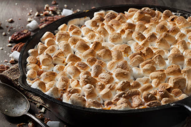istock Sweet Potato Casserole with Pecans and Marshmallows 1287112457