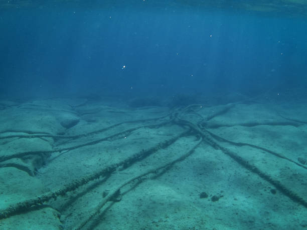 Underwater cables on stony ocean floor