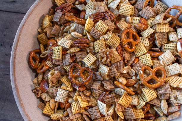 Holiday party mix of nuts, grain cereals, and pretzels stock photo